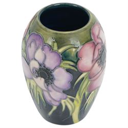 Moorcroft vase in Anemone pattern upon a dark blue ground, marked as a trial piece, impressed and painted marks to base, H14cm 