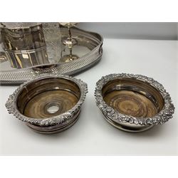 Pair of Mappin and Webb silver plate pierced pedestal bon bon dishes, together with other silver plate comprising teapot stand engraved with lion's head to centre, two cut glass claret jugs, two bottle coasters with acorn decoration, two open salts upon dolphin mounts, tea caddy, three piece cruet set and a large oval tray with pierced sides and upon four ball feet