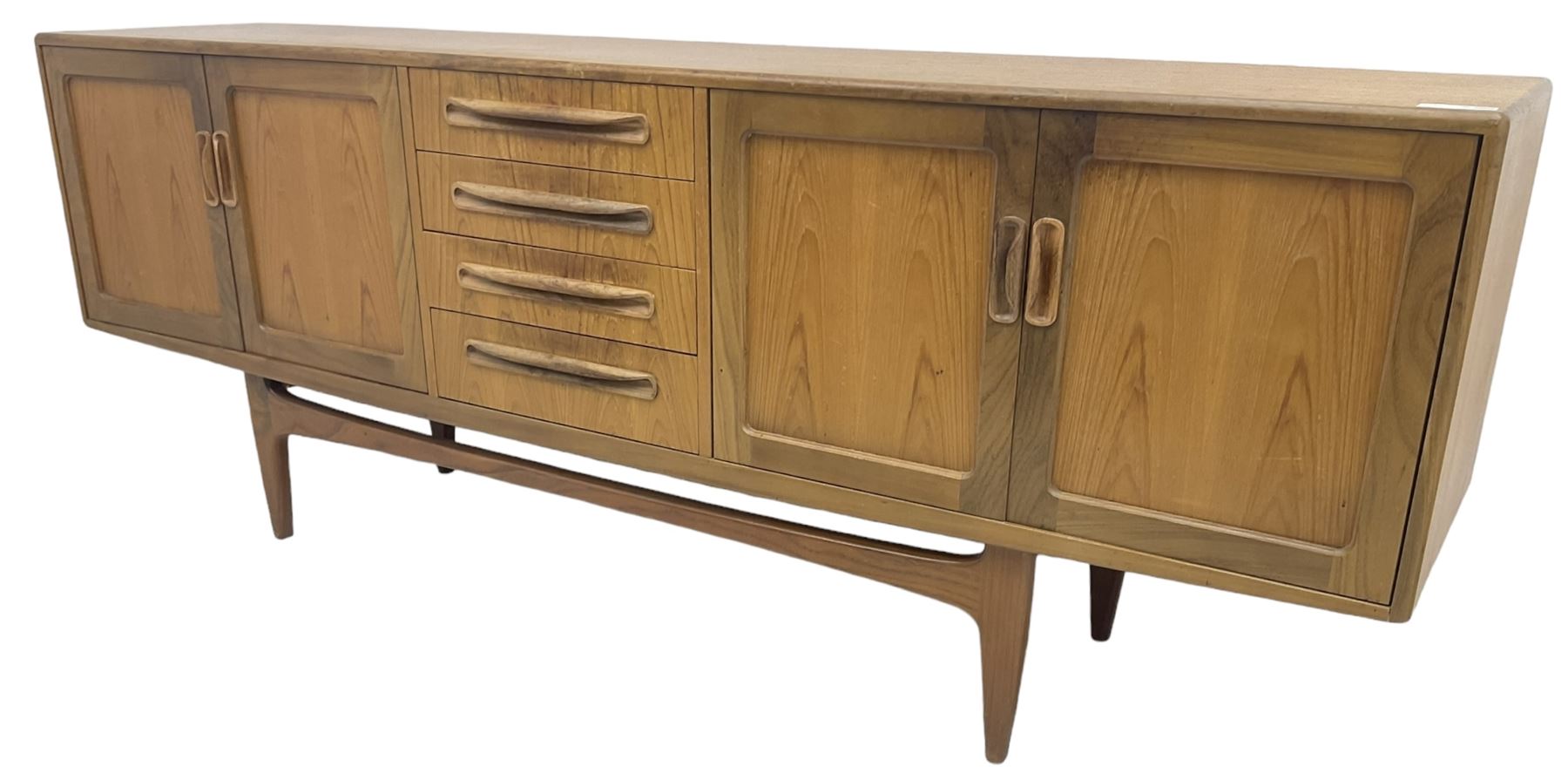 G-Plan – teak sideboard, four central drawers flanked by two double cupboards, enclosed by panelled doors 