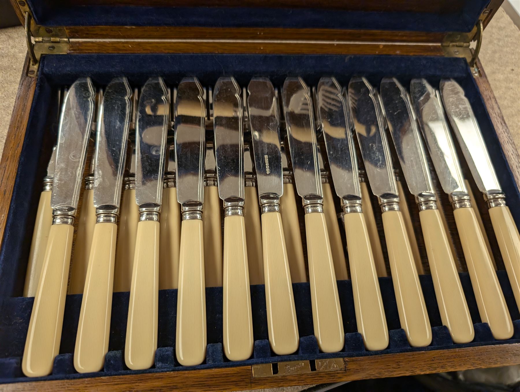 Three cased canteens of cutlery, including King's pattern set and two ivorine handled sets