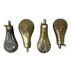 Four small copper/brass pistol powder flasks; two with stylised shell decoration; one with anthemion; and one with scrolls and flutes; largest H12cm (4)