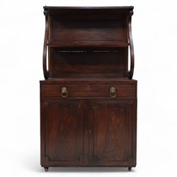 Regency mahogany lyre chiffonier, tall two-tier raised back with serpentine supports and brass pillars, the drawer fitted with sliding writing surface with divisions and pen and ink stands, seven internal drawers with lion mask handles enclosed by panelled doors, inlaid with ebony stringing
