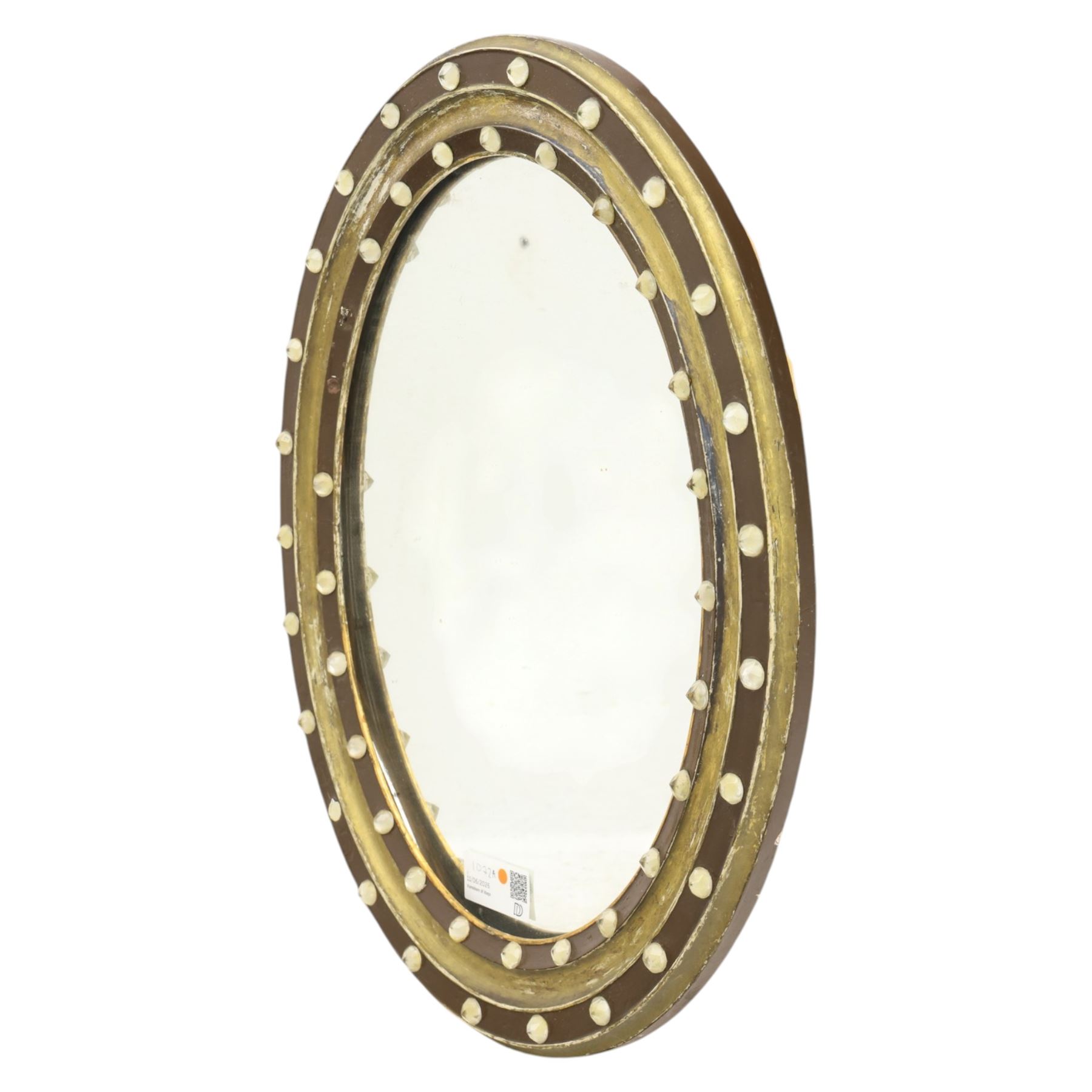 Regency design Irish oval wall mirror, circular frame with ebonized slip and two rows of applied glass ball decoration 