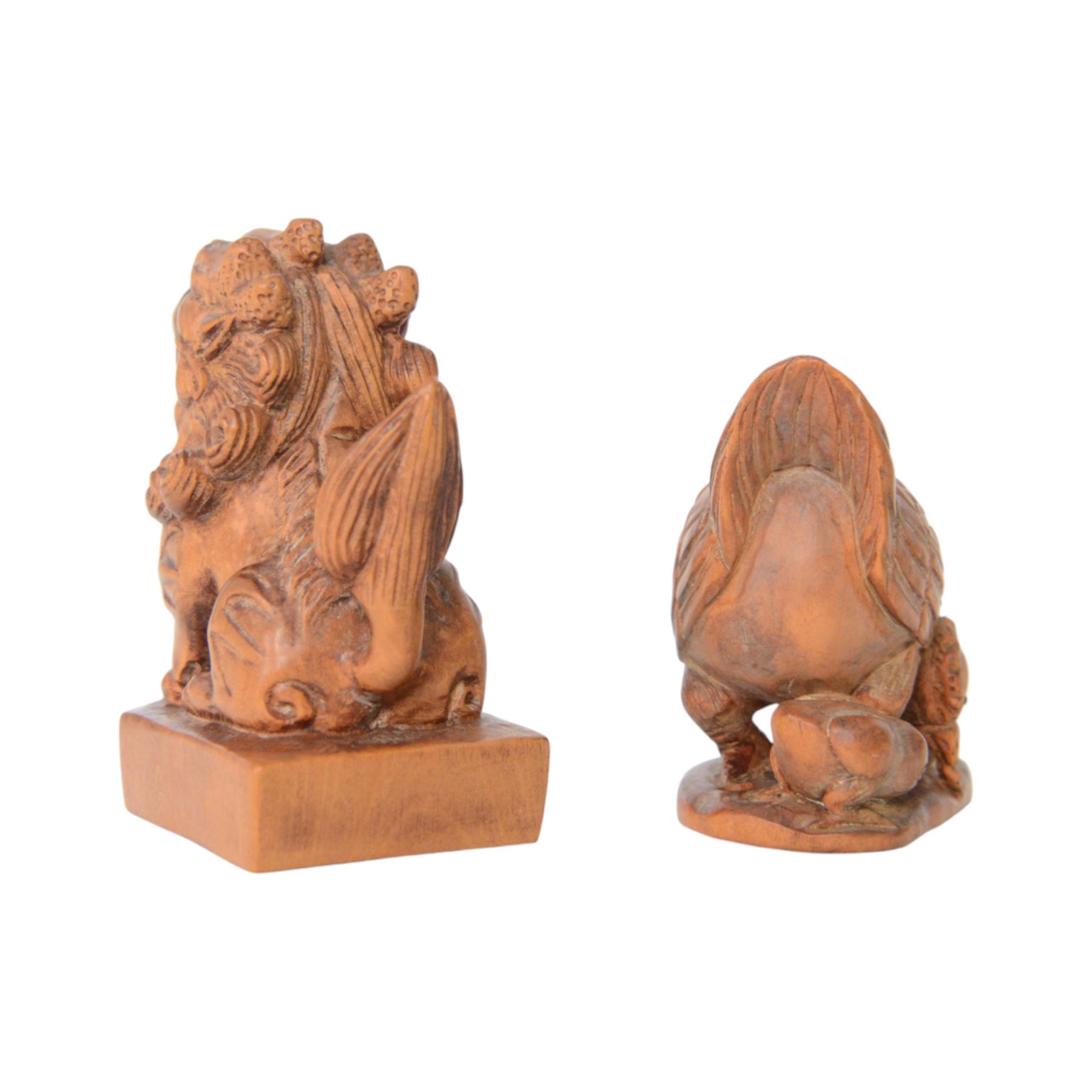  Two wooden netsuke, in the forms of a foo dog and a chicken, both signed to the base, H6cm