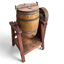 Two early 20th century dairy equipment items: Waide & Sons, Leeds – oak barrel butter churn with iron bands, later converted to electric operation, on trestle stand (W71cm H115cm); Lister – ‘Ball Bearing’ cast iron cream separator, with hopper and foot pedal, in red-painted finish (W47cm H49cm)