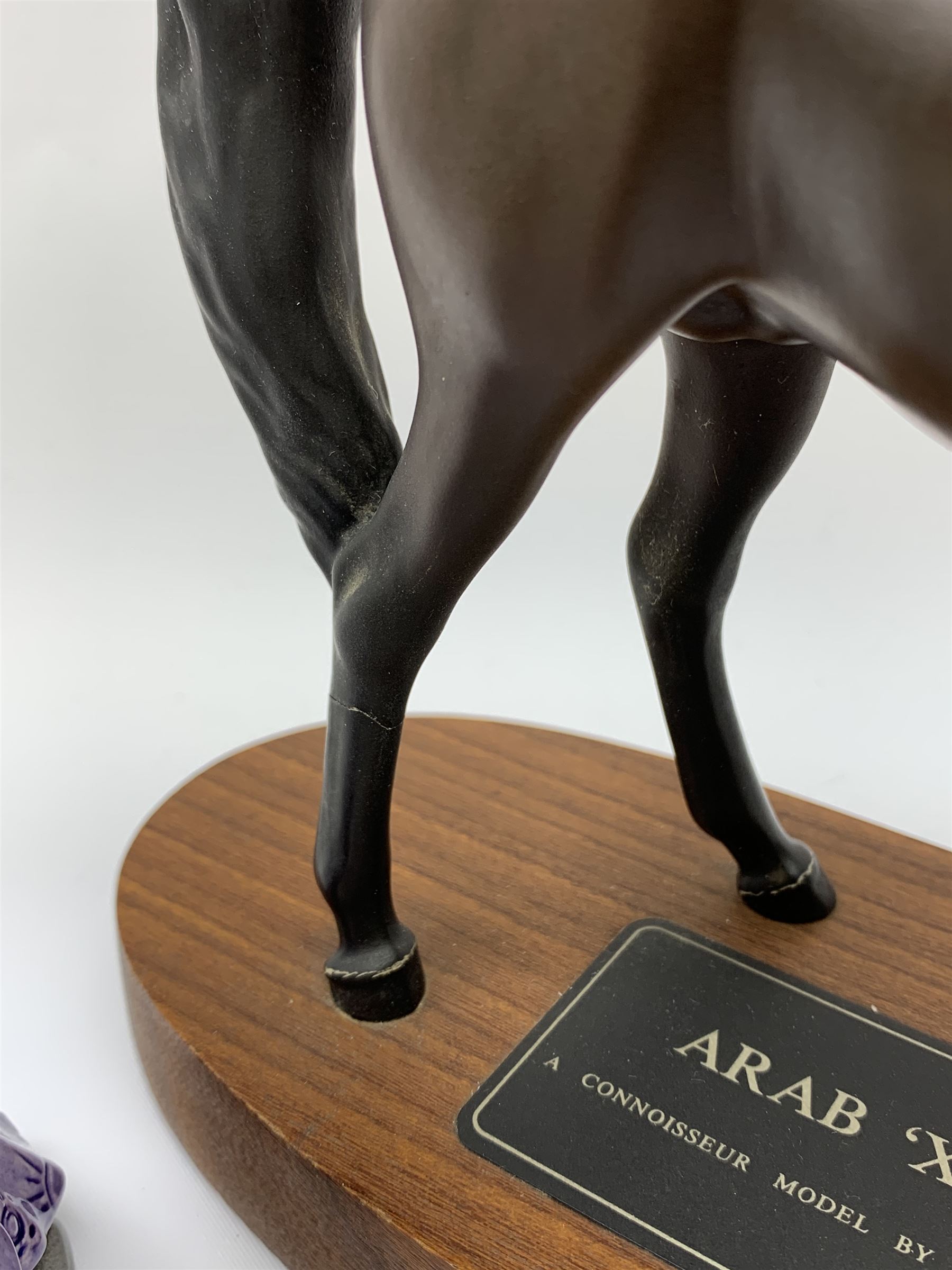 A Beswick Arab Xayal Connoisseur Horse in matt brown, upon a wooden base, together with two Royal Doulton figures, Mystic Bunnykins, and Dusty Dogwood. (3). 
