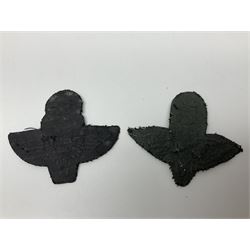 Parachute regiment - chrome crest on oak easel shield; three cloth badges; small silver plated figure; and pin badge; together with 10cm diameter cannon ball etc