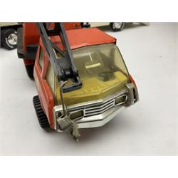 American Nylint large scale tin-plate car transporter L59cm carrying a Testor Toys plastic car; Tonka tin-plate mobile crane; boxed Sarony Cigarettes tin-plate roulette game with rules; and Japanese style tin-plate box, the lid inset with a revolving poker dice game (4)