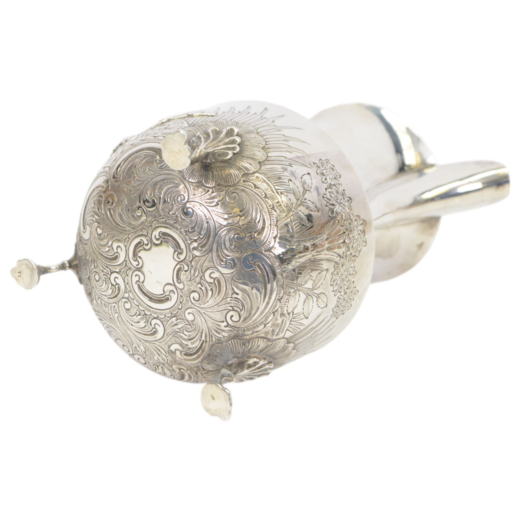 1920s silver hot water pot, with chased and repousse decoration to body depicting pheasants and rabbits in a countryside setting, with Bakelite type handle and finial, upon three palmette mounted feet, hallmarked S Blanckensee & Son Ltd, Birmingham 1928, H22cm