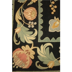 Kashmiri hand stitch wool rug, black ground, floral pattern, repeating border, 267cn x 175cm  
