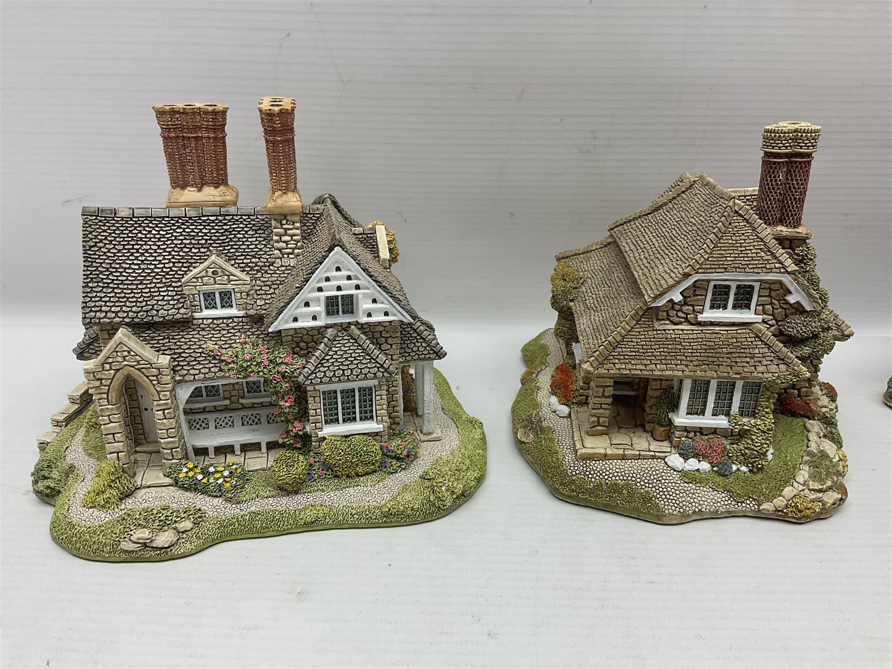 Eight Lilliput Lane limited edition Beatrix Potter models, including Buckle Yeat, Tabitha Twitchits Shop and Ginger Pickles Shop, together with twelve Lilliput Lane models from the Blaise Hamlet collection, including Dial Cottage, Diamond Cottage and Vine Cottage, all with deeds and original boxes (20)