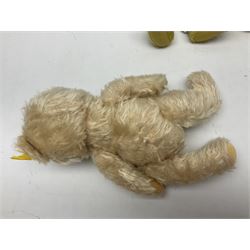 Two Steiff plush covered teddy bears, each with button and label in ear H35cm; Steiff plush covered reclining dog with open mouth; another teddy bear dressed as a doctor; and an English teddy bear (5)
