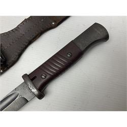 WWII German K98 Mauser bayonet by E. & F. Horster, the 24.5cm fullered blade marked 43aSW for 1943, numerous inspection marks to blade and pommel, bakelite grips and bluing to metal parts; in steel scabbard with corresponding numbers and leather frog L42cm overall