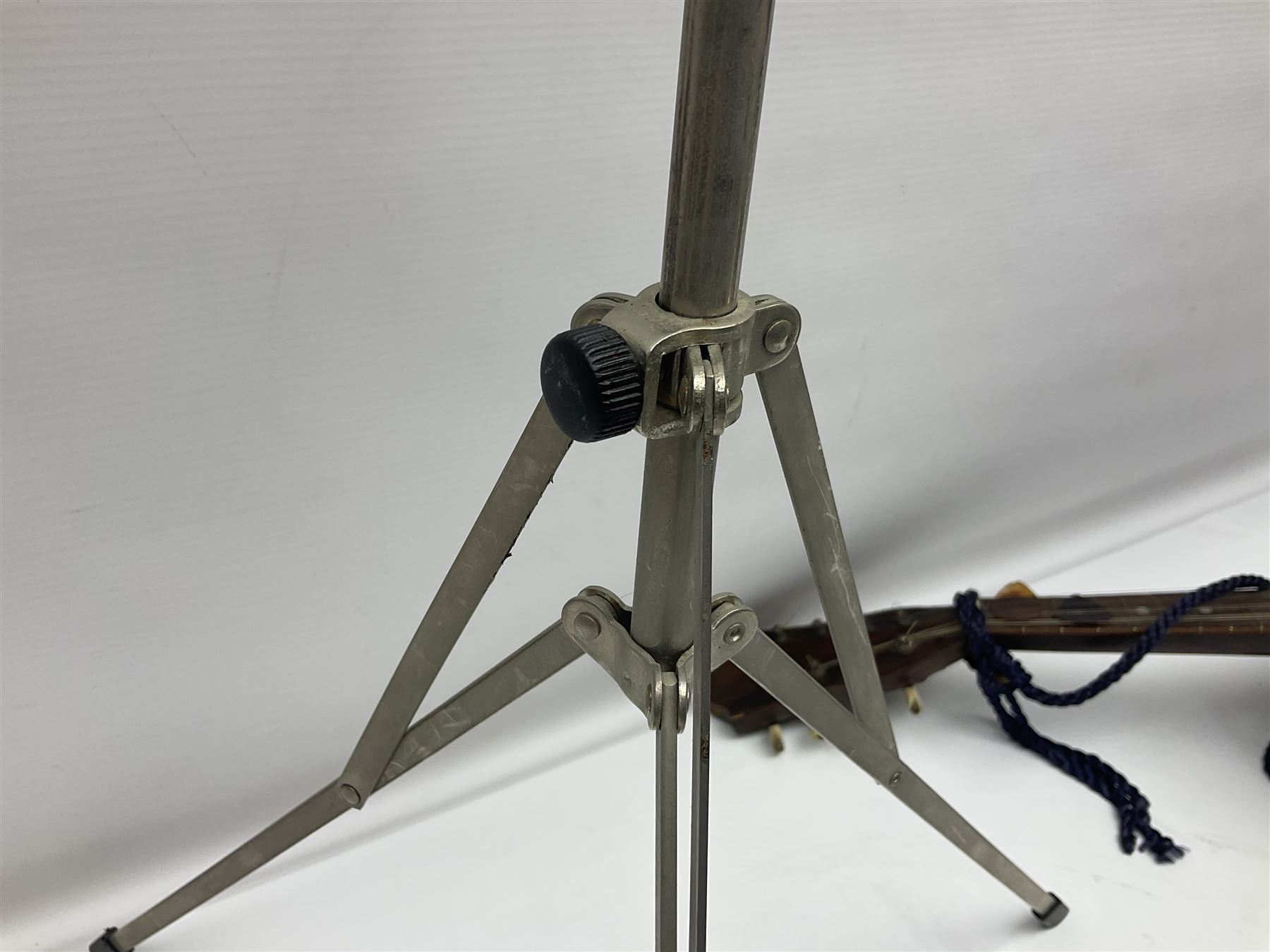 Late 19th/early 20th century Italian lute back mandolin with segmented back and spruce top; bears maker's label for Pietro Tonelli Napoli; together with a mandolin instruction booklet and a folding music stand L60.5cm