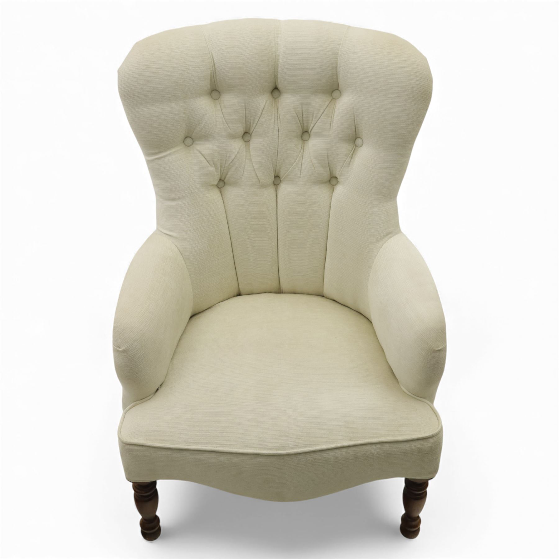 Late 20th century cream upholstered nursing chair, high button-tufted back with shaped wings, scroll arms, loose seat cushion, raised on turned front supports