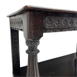  17th century oak buffet or side table, moulded rectangular top over guilloche carved frieze rails and rear upright supports, turned and flute carved front supports united by under tier