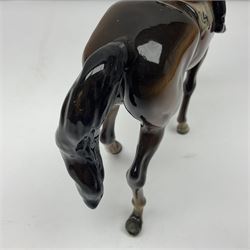 Beswick jockey on walking horse no 1037, in black white and yellow jockey colours, with printed mark beneath, H22cm