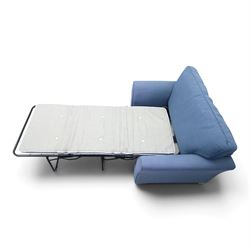 Contemporary blue small sofa bed, shaped arms with loose seat cushions, stowed bed beneath, raised on light wood feet