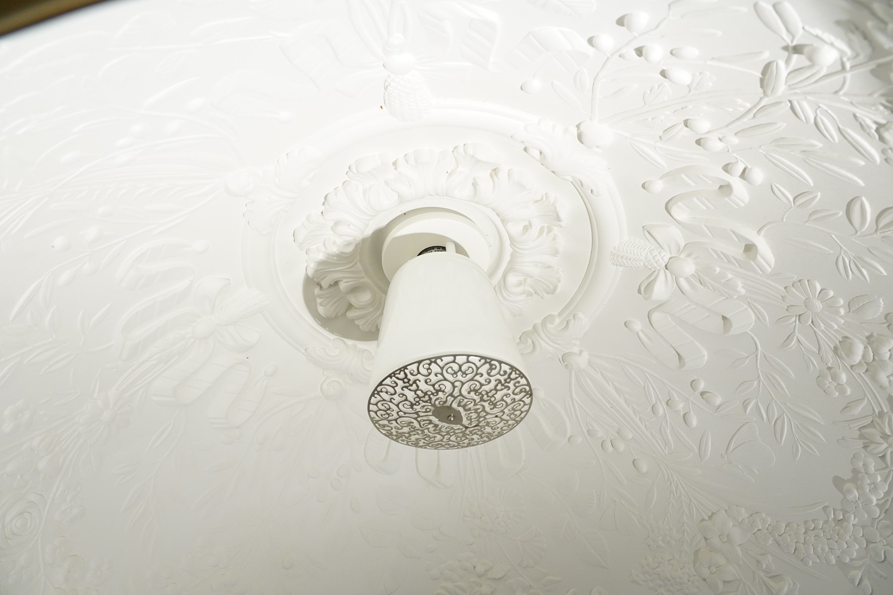 Marcel Wanders for Flos - pair of 'Skygarden S2' suspension lights, the monumental gilt domed shades concealing richly modelled white plaster interiors of Baroque-inspired floral and foliate ornament, with a large moulded central ceiling rose comprised of acanthi and extending ribbon festoons