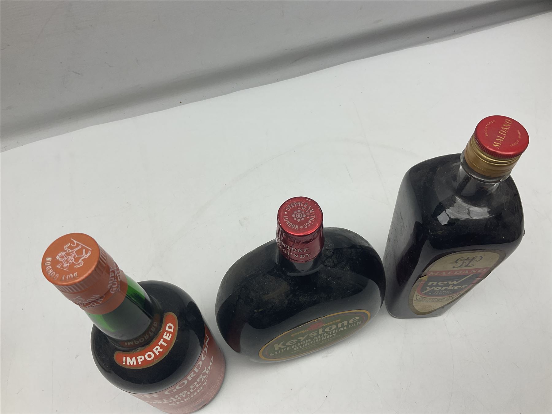 Mixed alcohol, comprising Keystone Australian Burgundy, unknown content and proof, Maldano New Yorker Wine Aperitif, unknown content and proof and Duff Gordon Sherry, unknown content and proof (3)