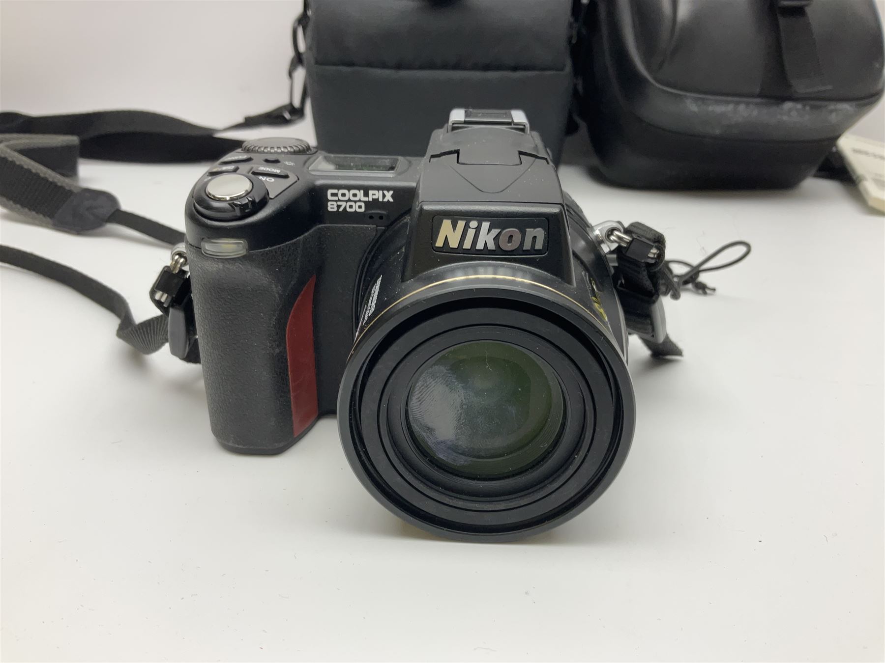Nikon Coolpix 8700 camera body, serial no 3220838, with Zoom Nikkor Ed 8.9-71.2mm 1:2.8-4.2 lens, together with Canon digital video camcorder and other digital cameras and camera equipment