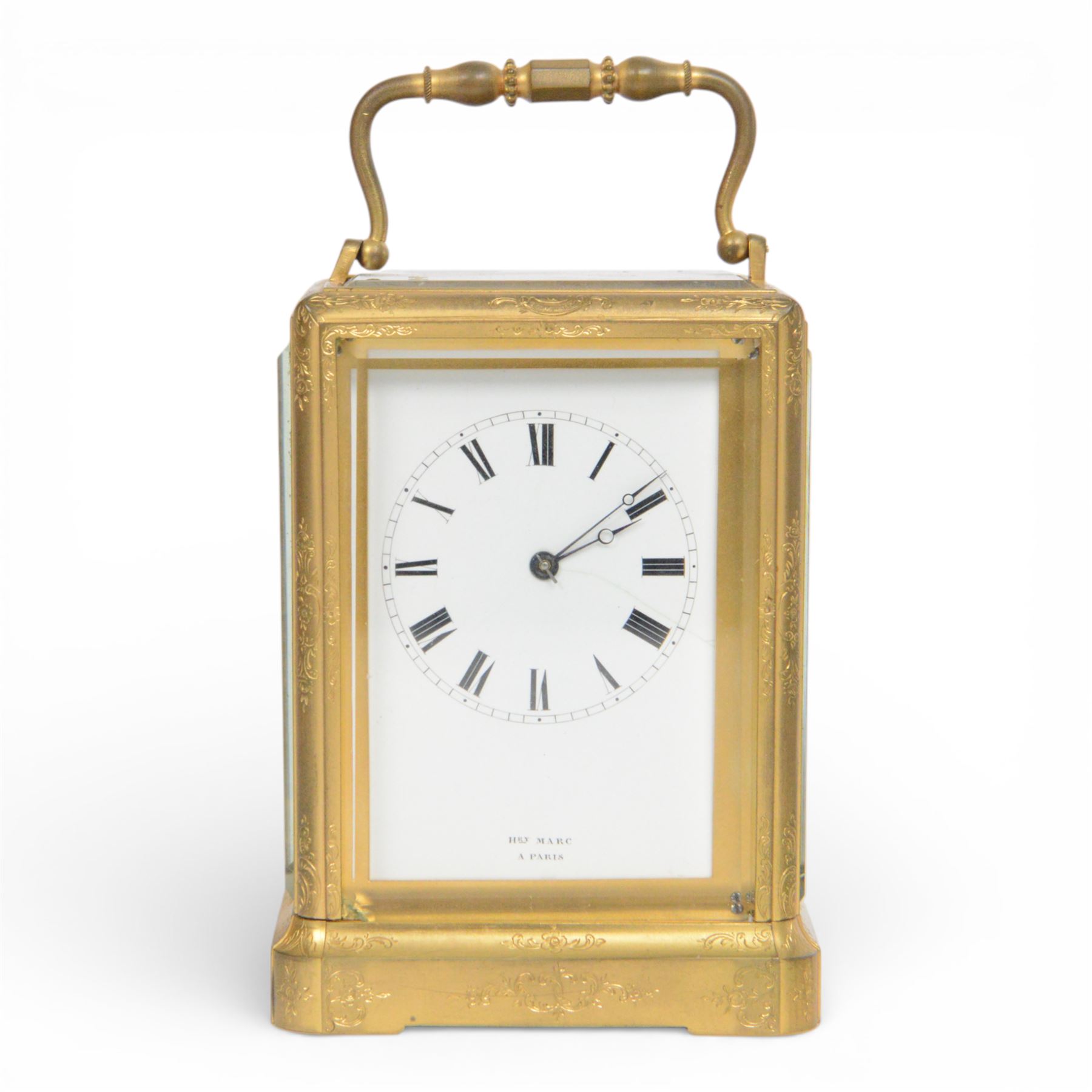 Late 19th century French 8-day brass cased carriage clock, Henry Marc of Paris, the gorge case with swing handle and four bevelled glass panels, white enamelled dial with Roman numerals and minute markers and steel hands, the two train movement with platform lever escapement, hour striking on a bell, with key