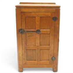 Mouseman - early-to-mid-20th century adzed and panelled dark oak bedside cupboard, raised ...