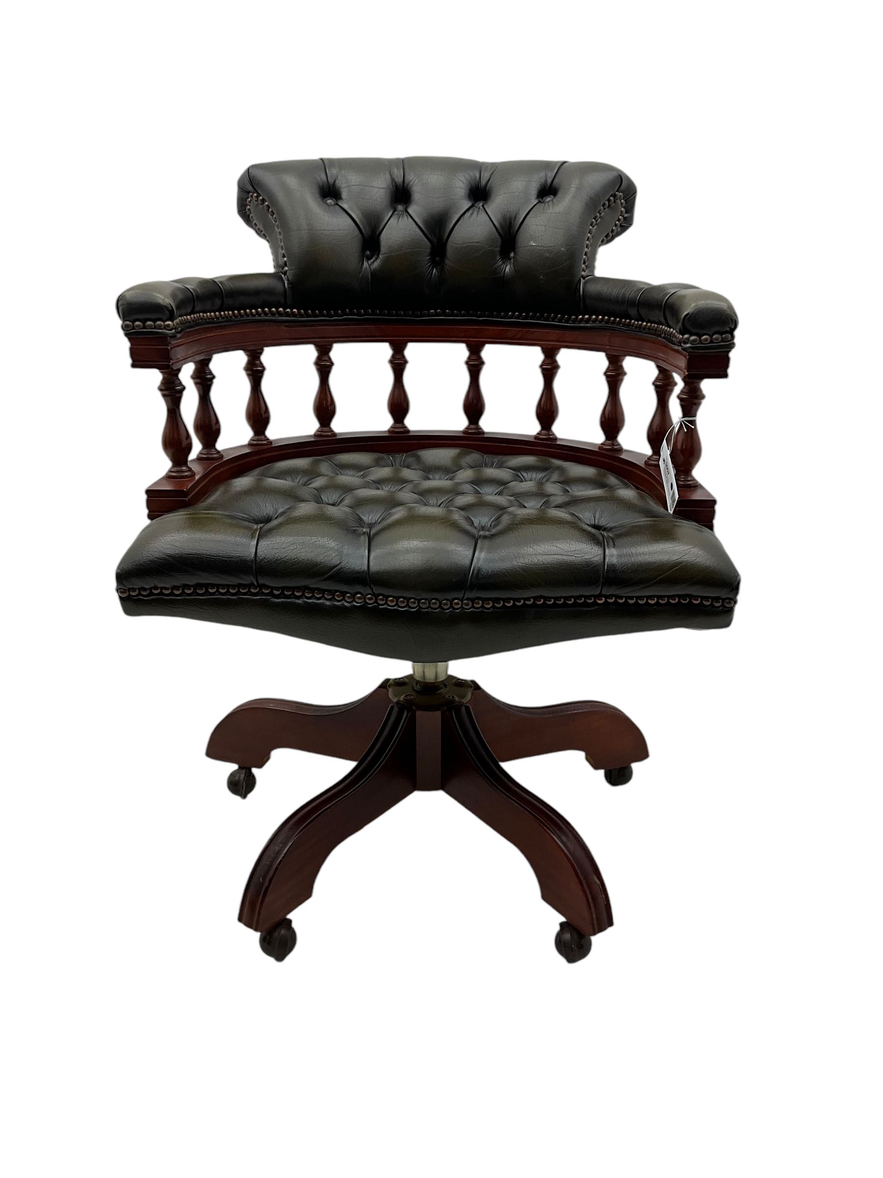 Captain's swivel desk chair, upholstered in studded green leather