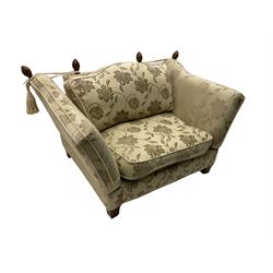 Knole ‘Snuggler’ drop arm sofa upholstered in pale fabric with raised floral pattern, with scatter cushions