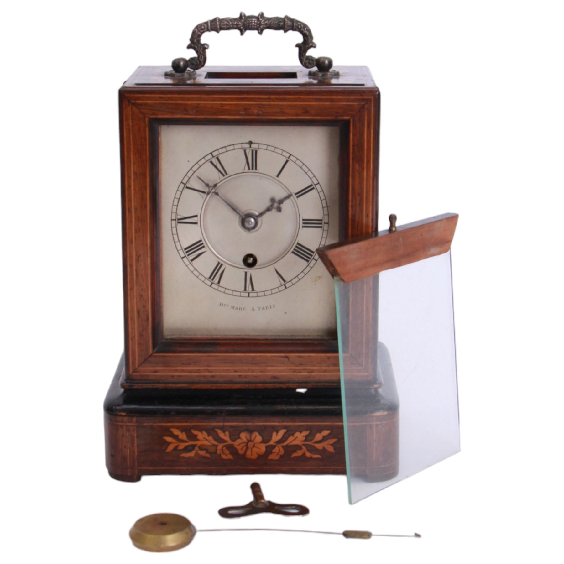 Henry Marc of Paris -  mid 19th century 8-day Pendule d'officier campaign clock in a rosewood veneered case with contrasting floral and leaf inlay and ebonised moulding, rectangular case with a brass carrying handle and sliding glass panel to the silvered sheet dial, chapter ring with Roman numerals, minute track and steel trefoil hands, with a single train timepiece movement and silk suspension. With pendulum and key. 