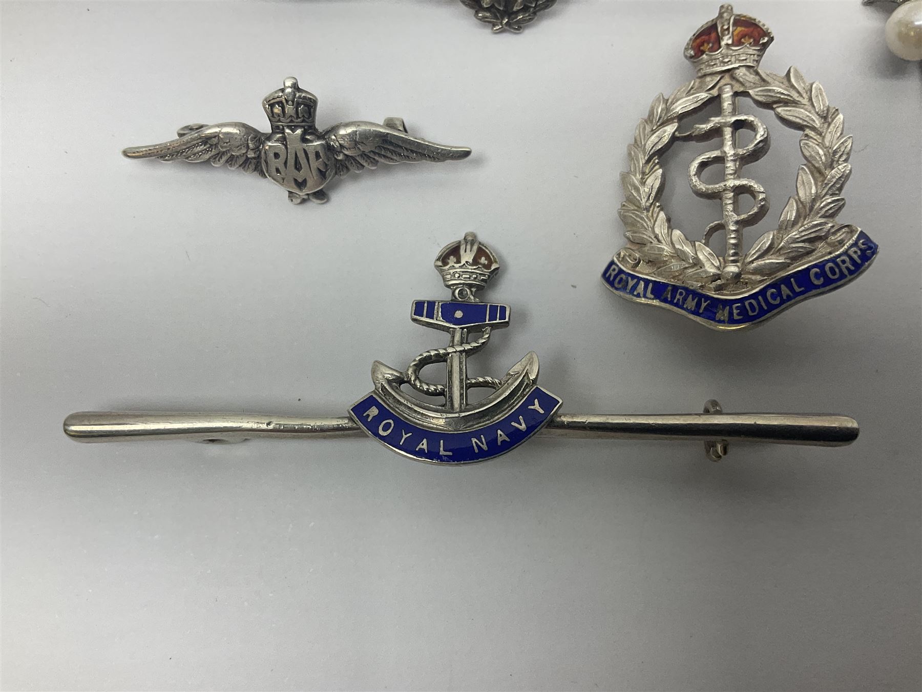 Five sterling silver sweetheart brooches - enamelled Royal Navy, enamelled RAMC, two graduated RAF and cultured pearl and paste flaming grenade stick-pin (5)