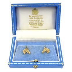 Pair of 9ct gold horse's head stud earrings, hallmarked, in Gerrard & Co box