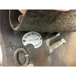 Collection of nine saddles, mainly havana leather to include a racing saddle and a Goodwin saddle, some with stirrups and leathers 