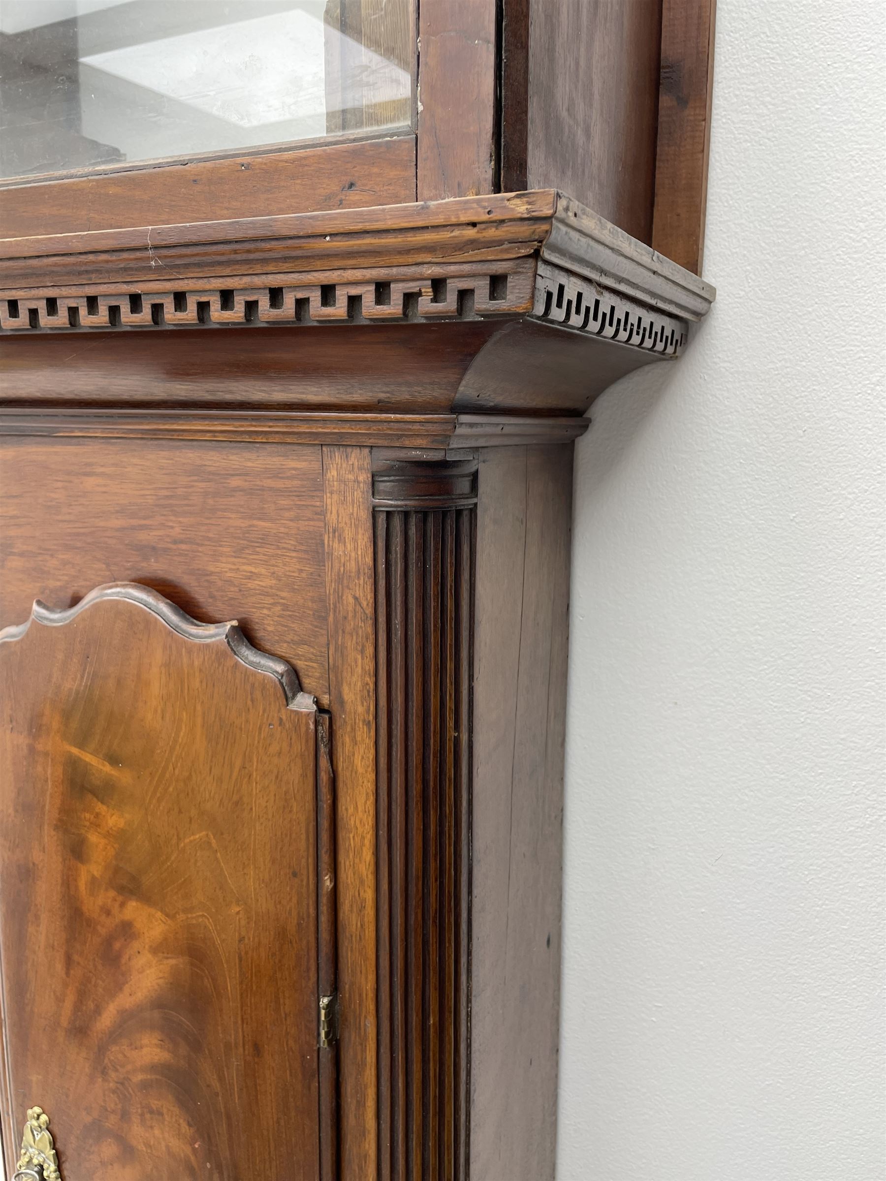 Late 18th century clock movement and dial, square brass dial with Arabic and Roman chapter ring signed 'Thos. (Thomas) Johnston, Dublin', with subsidiary seconds dial and calendar aperture, the dial set with ornate mask cast spandrels, twin train eight day movement striking on bell, with anchor escapement (34.5cm x 34.5cm, 13 1/2