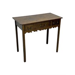 18th century oak lowboy, rectangular moulded top over three frieze drawers with brass swing handles, scalloped apron, on slender square section supports