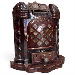 Deville & Cie of Charleville - early 20th century Art Deco cast iron and burgundy enamel 'Cristal' wood burning stove, hinged vent over lattice glazed door and ash drawer, on shaped geometric base, circa 1920