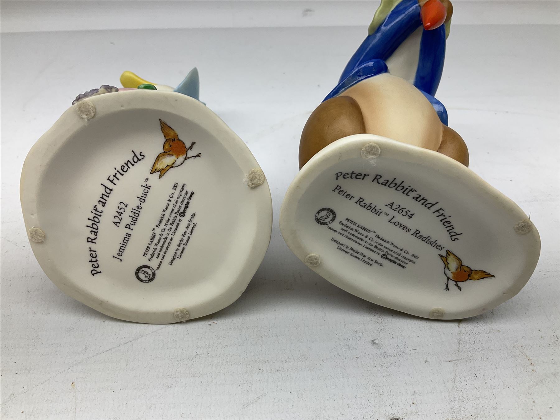 Two Border Fine Arts Peter Rabbits and Friends figures, comprising Peter Rabbit Love Radishes A2654 and Jemima Puddle-duck A2452