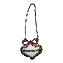 Seventeen mid 18th century and later enamel wine labels, one example of heart shaped form, the rest of cartouche and escutcheon form, various titles including Claret, Rum, Sloe Gin, Port, Whisky, Cowslip, Cherry-Brandy, etc., largest example W7cm 