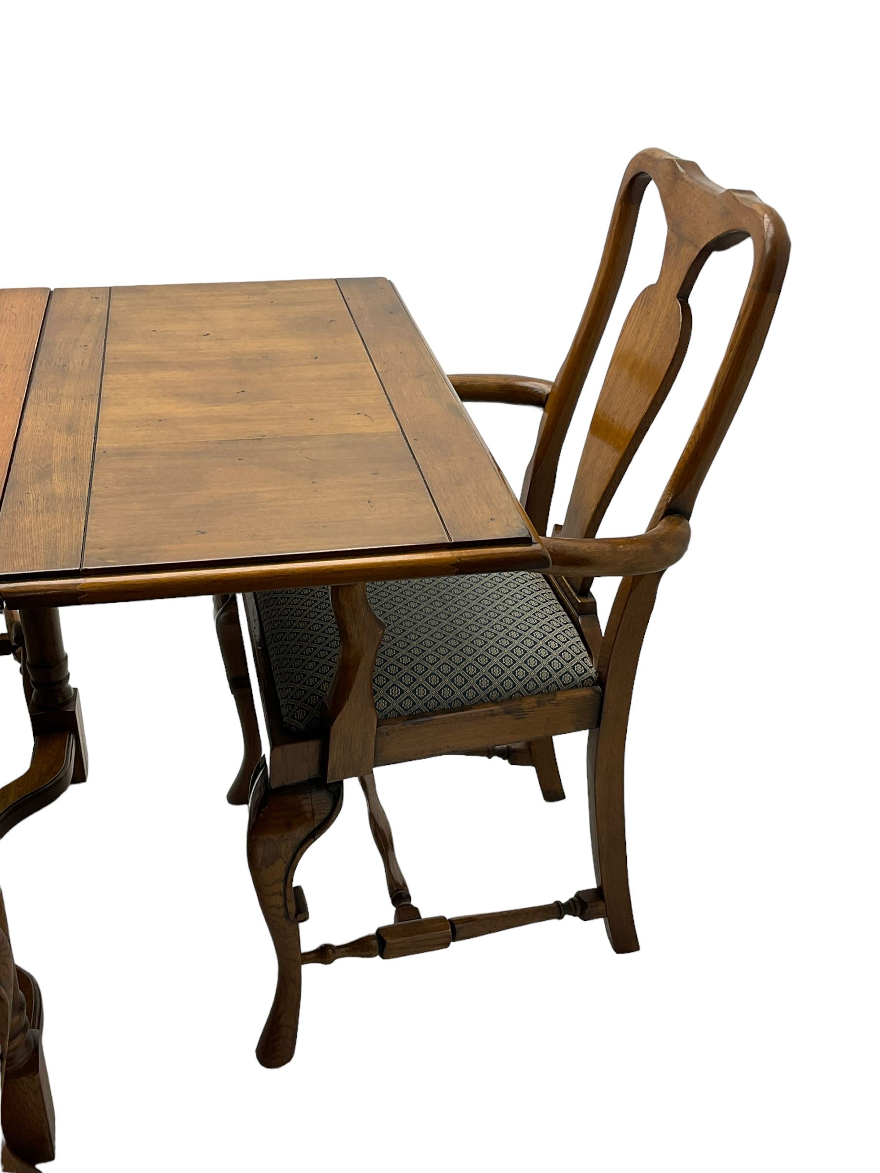 Late 20th century oak dining table, rectangular top with two draw leaf extensions, on turned supports united by moulded hayrake stretchers (180cm - 278cm x 90cm, H76cm); set of eight (6+2) oak dining chairs, shaped cresting rail over shaped splat back, upholster drop-in seat, on cabriole supports united by turned H-shaped stretchers 