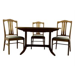 G-Plan - mid-20th century teak extending dining table, oval top with concealed central butterfly leaf extension, raised on splayed supports with cross-stretcher; three dining chairs with curved top rail and vertical splats