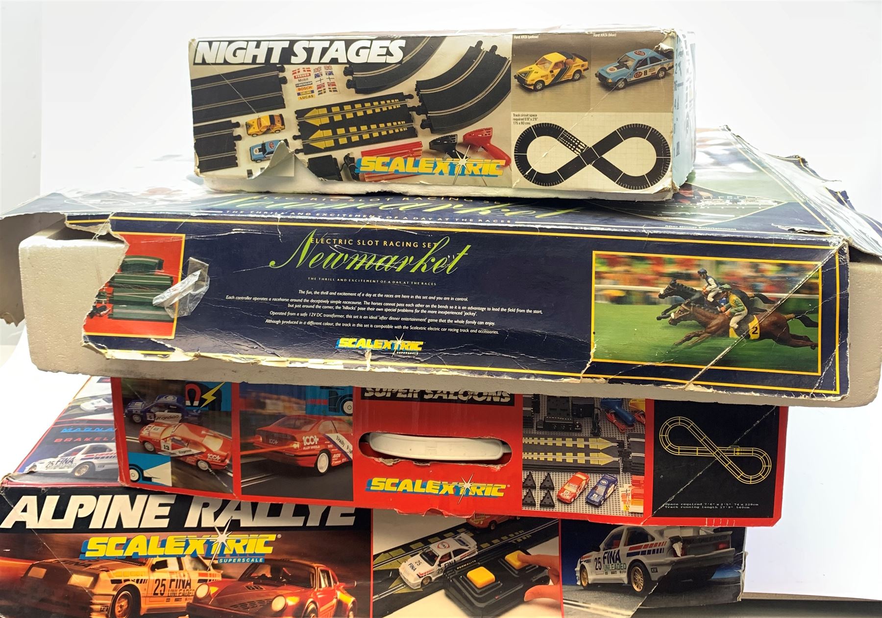 Scalextric, Alpine Rallye, Electric Slot Racing Set Newmarket, Super Saloons, and Night Stages. (4). 