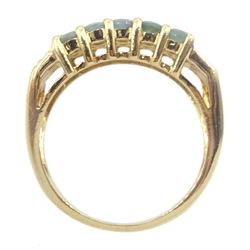 Gold three row green amethyst ring, each end set with four round brilliant cut diamonds, stamped 14K