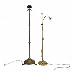 Early 20th century brass standard lamps, one with domed circular base and reeded column, t...