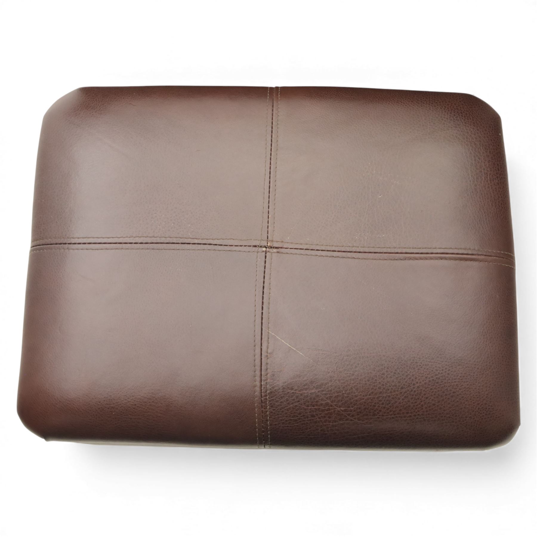 Laura Ashley - brown leather armchair and foot stool, loose cushion back and seat, flanked by scrolled arms upon light stained wood supports on castors, matching brown leather footstool with four panel top over light stained supports on castors (Footstool H 31cm, W 52cm)