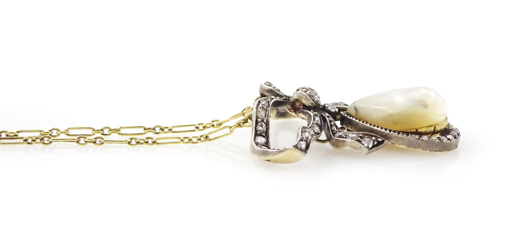 French early 20th century gold and silver pearl and diamond bow pendant, pear shaped blister pearl with old cut and rose cut diamond surround, suspending from a diamond set bow, to an 18ct gold fancy link chain necklace