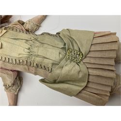 Victorian wax shoulder head doll with applied hair, inset glass eyes and jointed body with composition lower limbs; faded pink dress H35cm