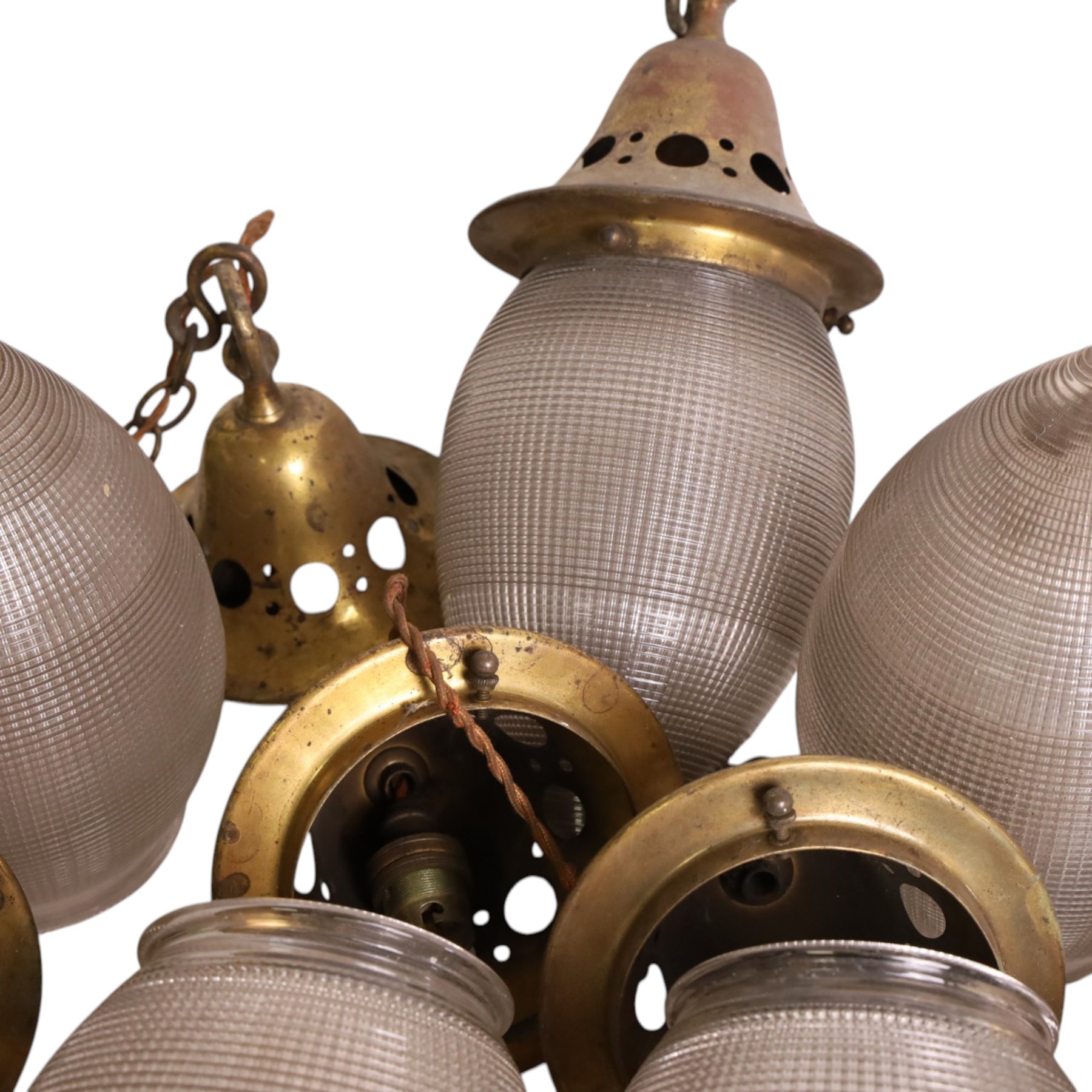 Set of eight French Art Deco Blondel Holophane pendant lights, the glass acorn shades, with pierced brass fittings, shades H35cm