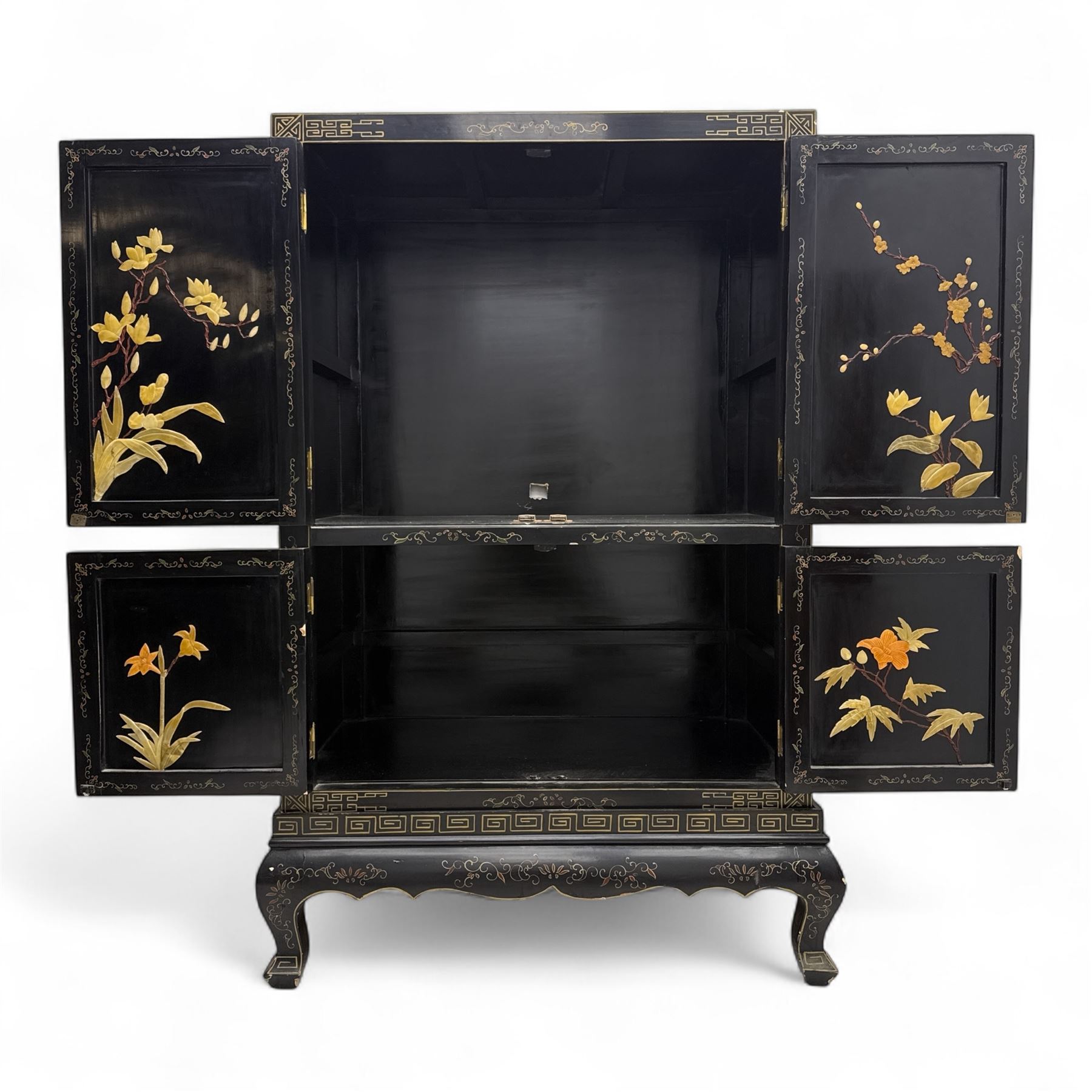 Late 20th century Chinoiserie black lacquer cabinet, the rectangular body decorated with hand-painted floral and foliate motifs in polychrome and gilt, fitted with four panel doors enclosing shelved interior, on shaped apron and stylised cabriole supports with gilt scrollwork