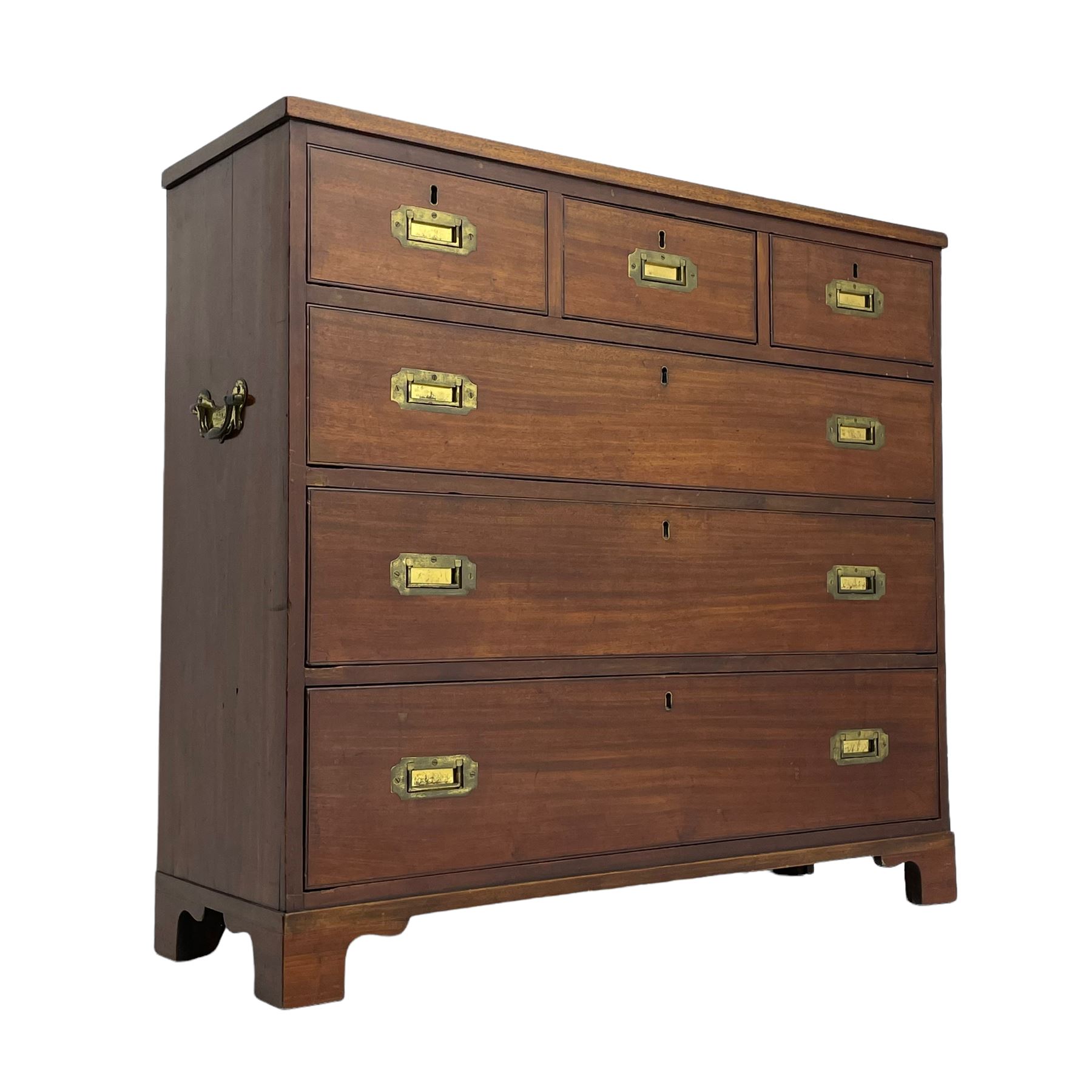 Georgian military type campaign chest, narrow rectangular top over three short and three long drawers, recessed brass handles, on bracket feet
