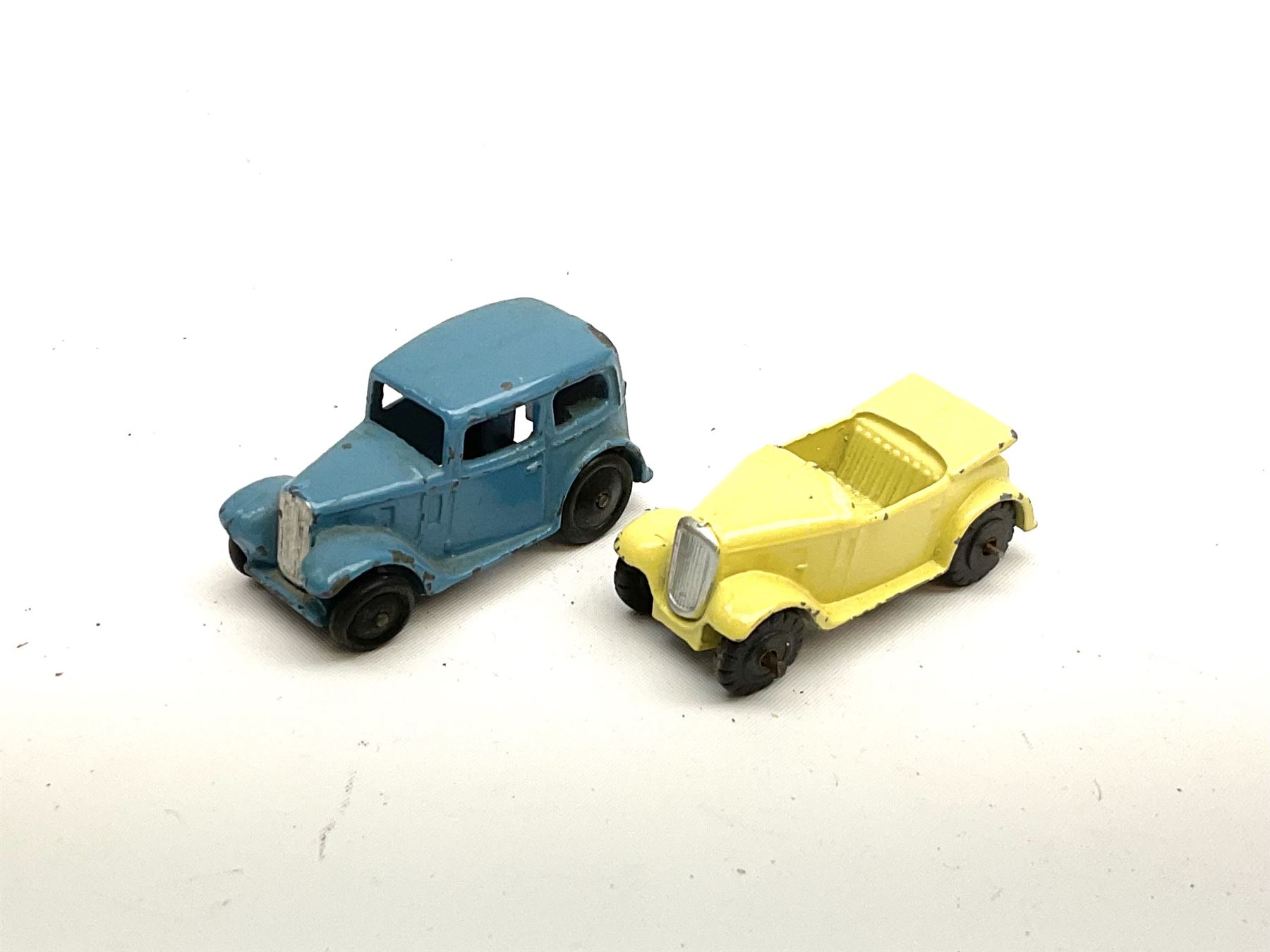 Dinky - seven unboxed and playworn die-cast cars comprising Studebaker, Ford Sedan, Rover 75, Vanguard, Austin Somerset and two Austin Devons; together with two Dublo size scale cars (9)